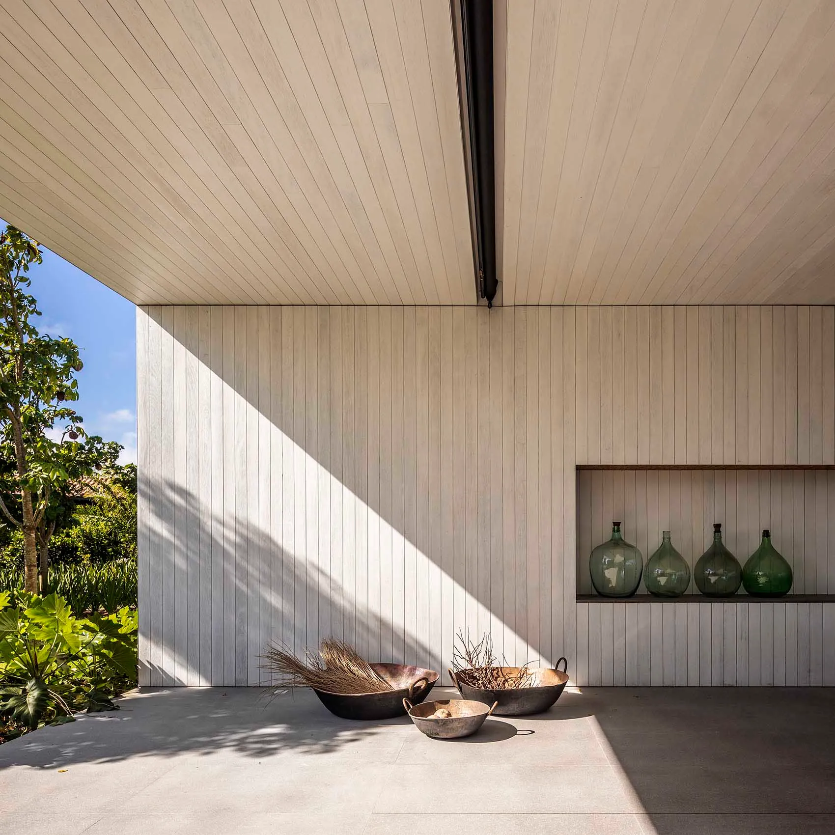 A modern house exterior featuring wood paneling and geometric design.