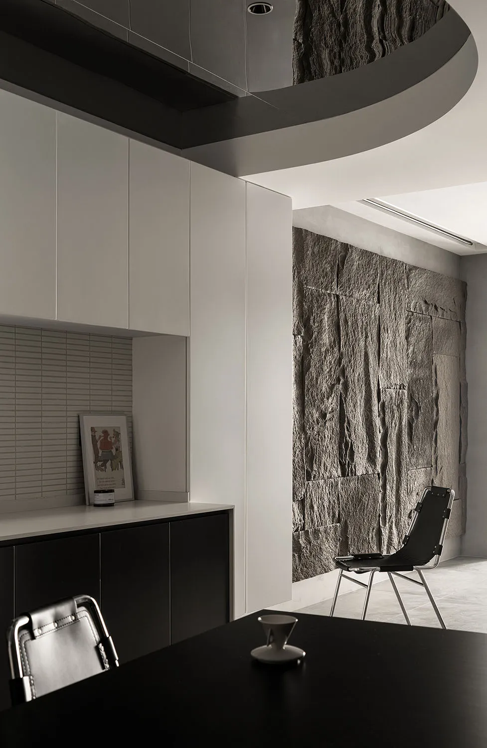 A modern office space featuring concrete walls and a minimalist design.