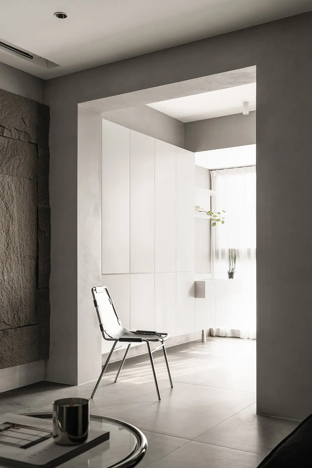 A minimalist modern interior design featuring concrete elements.