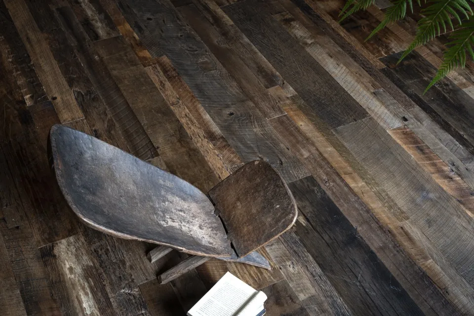 An industrial-style bookshelf made of reclaimed wood.