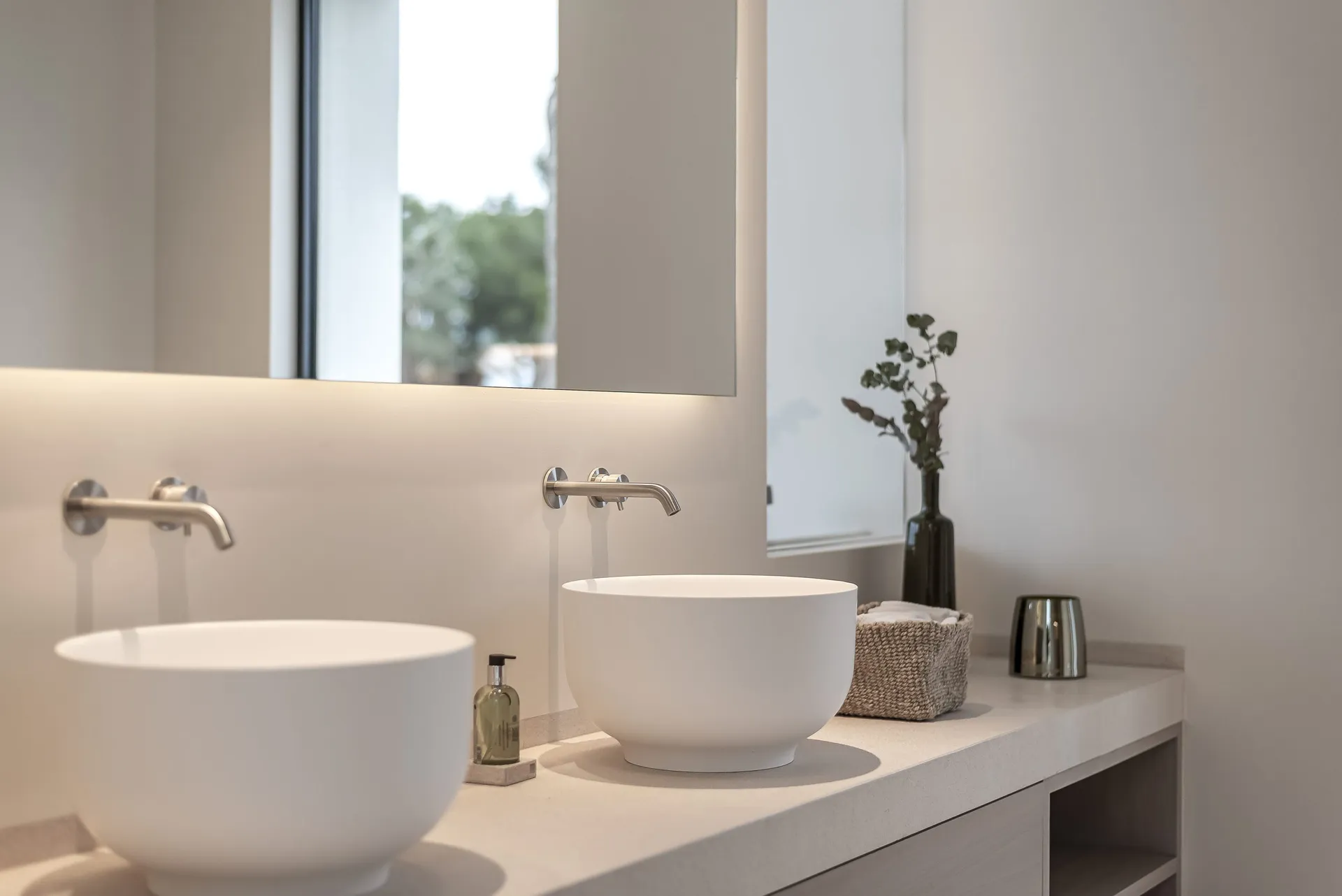 Modern bathroom interior with concrete counter and sink.