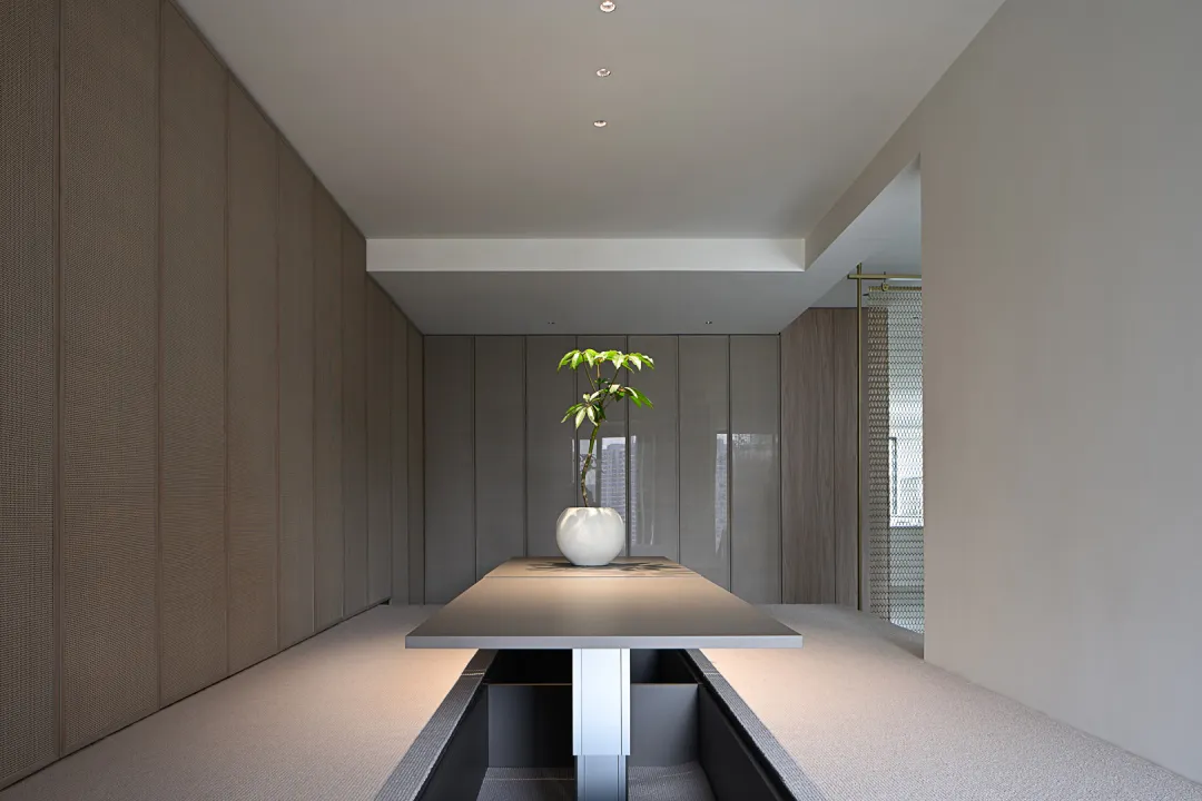 A minimalist office space with a white desk.