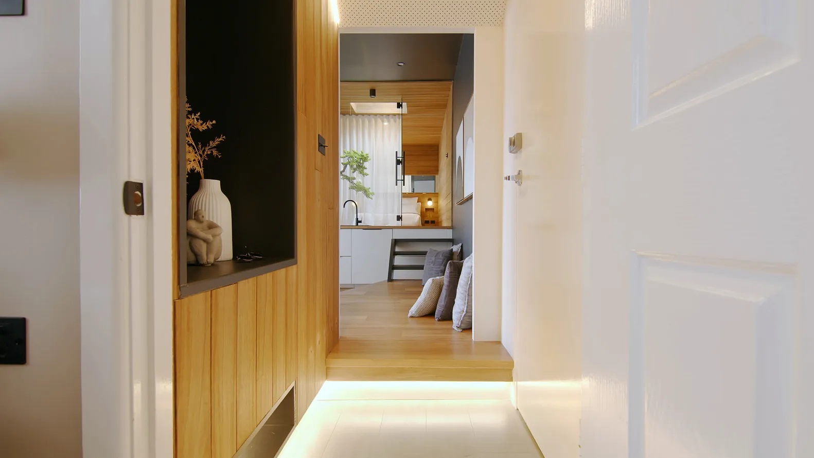 View of an industrial-style residential home interior with wood accents and a modern aesthetic.