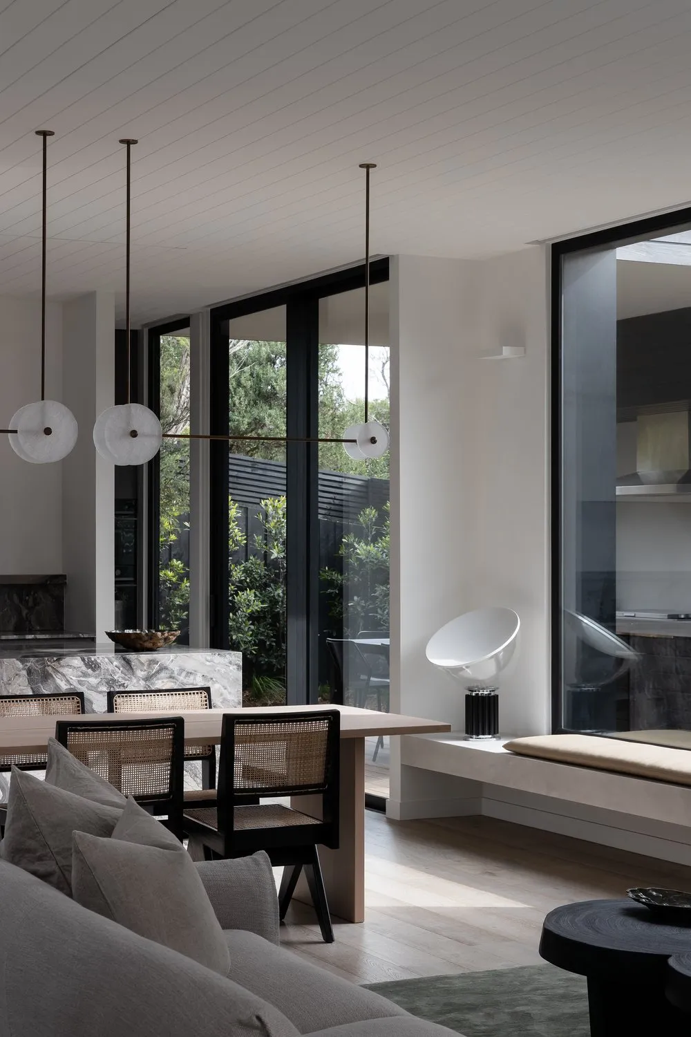 Minimalist modern interior design featuring marble and concrete materials.
