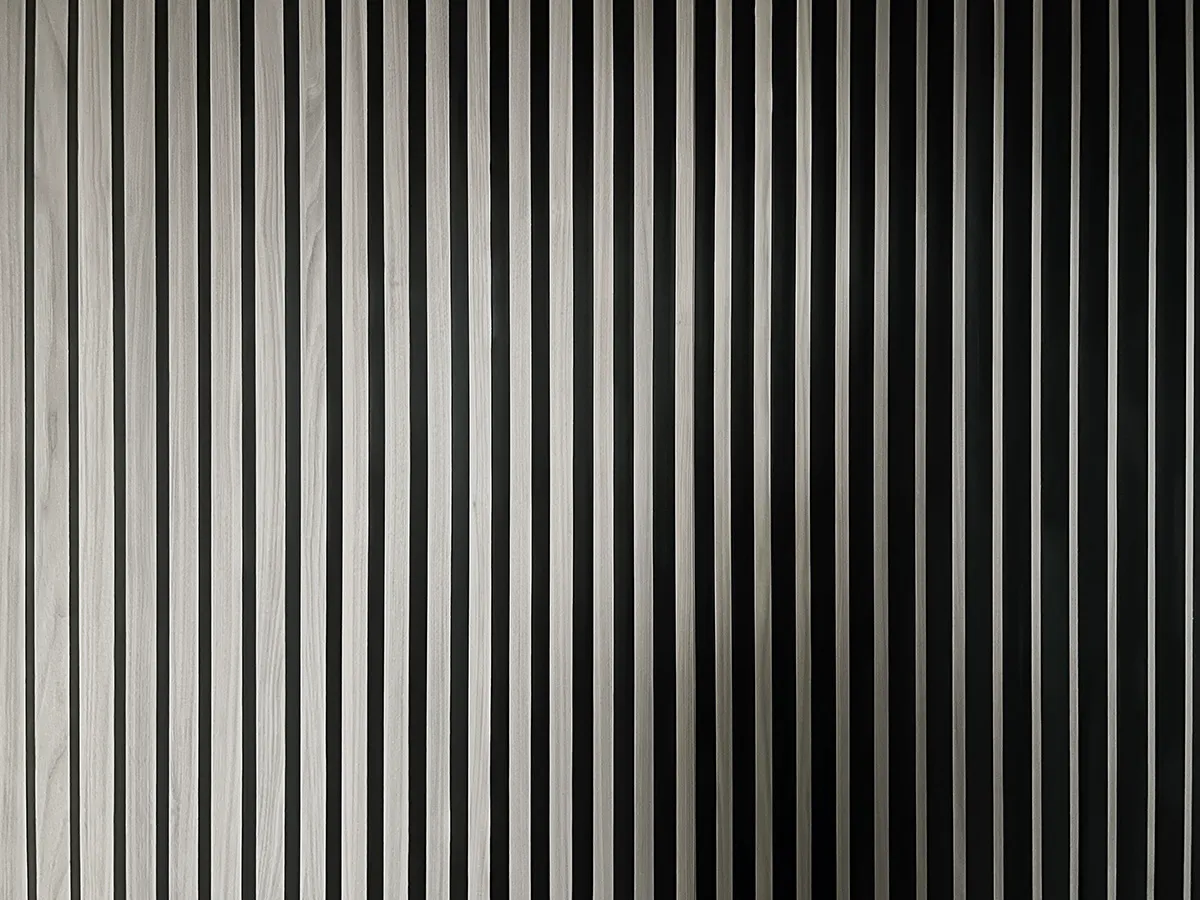 Minimalist metallic panels creating a vertical striped pattern on a wall