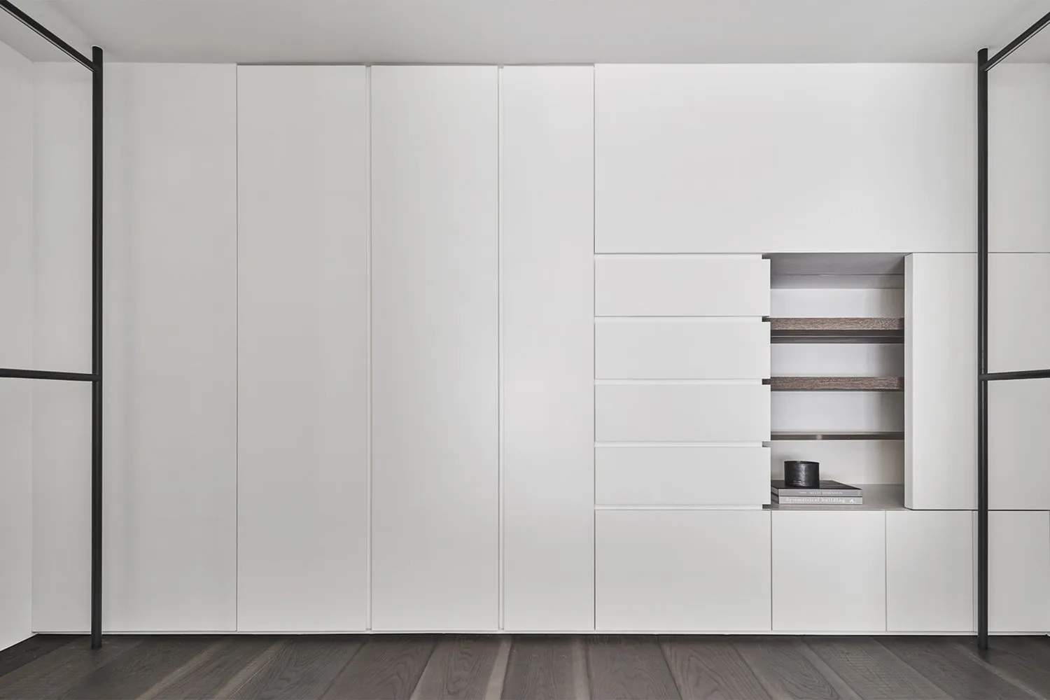 A modern, white storage cabinet with sleek, minimalist design and multiple storage compartments.