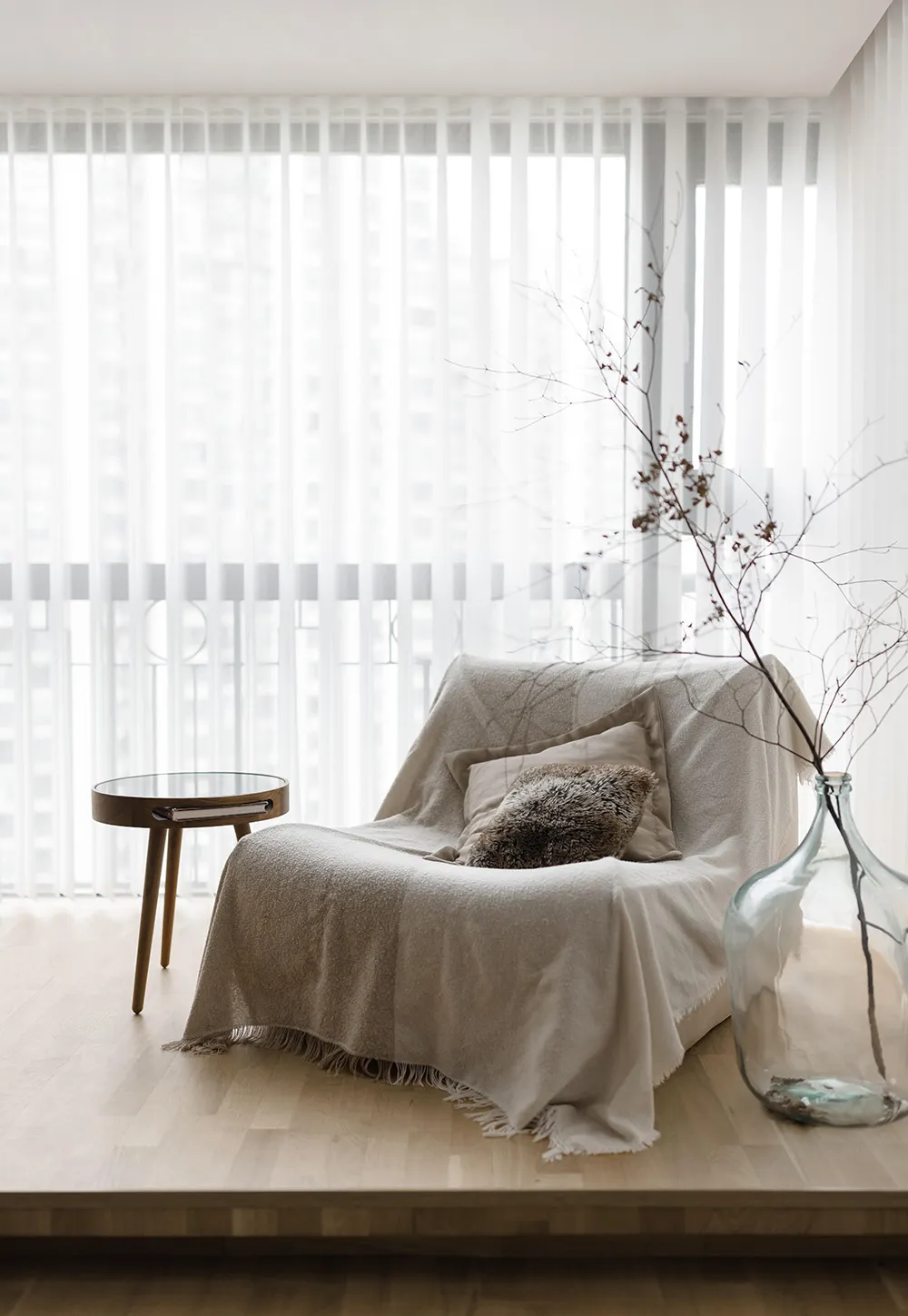 A modern minimalist living room with neutral tones