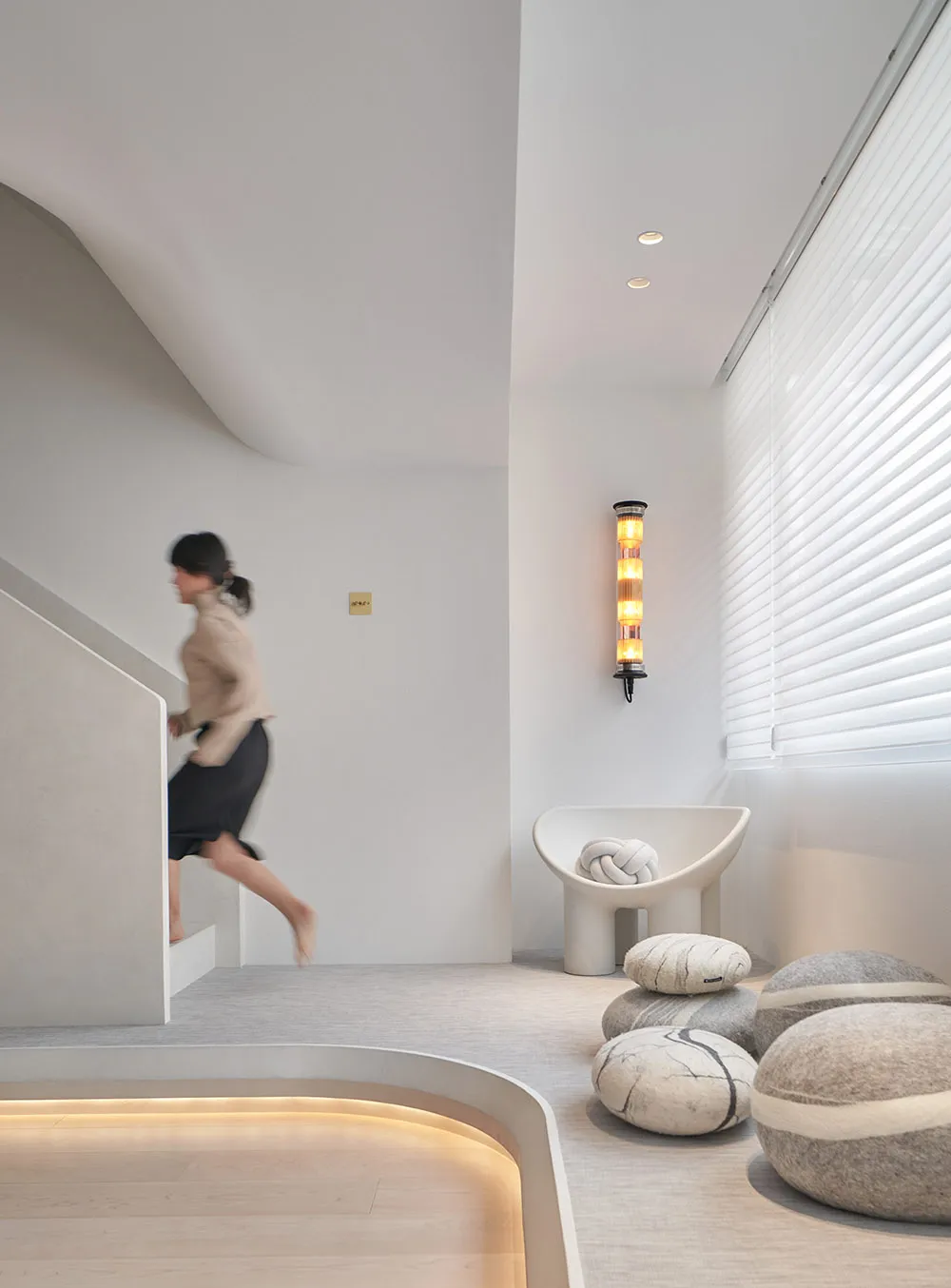 Modern minimalist interior design featuring concrete and glass elements.