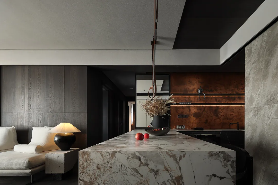 Kitchen with a marble countertop and contemporary design elements.