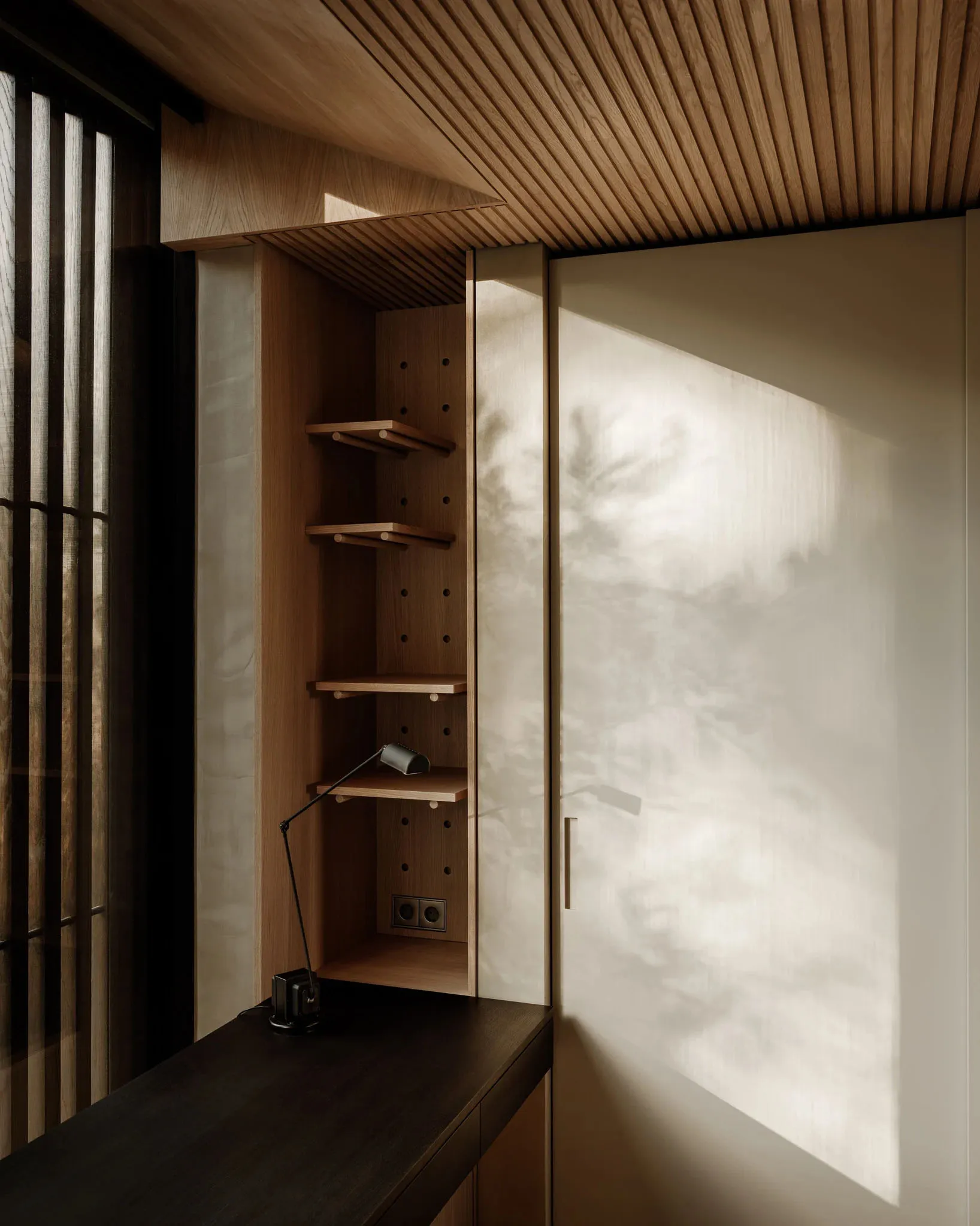 Modern minimalist living room featuring wooden walls and minimal decor.
