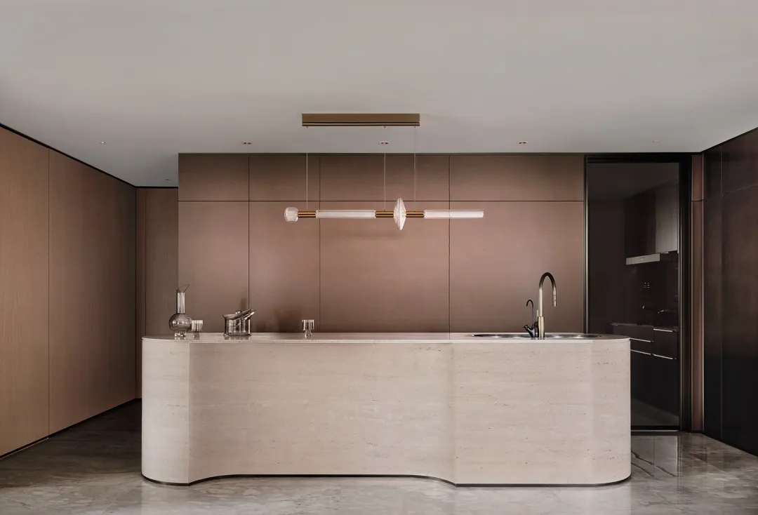 Modern residential kitchen with marble countertops and minimalist design
