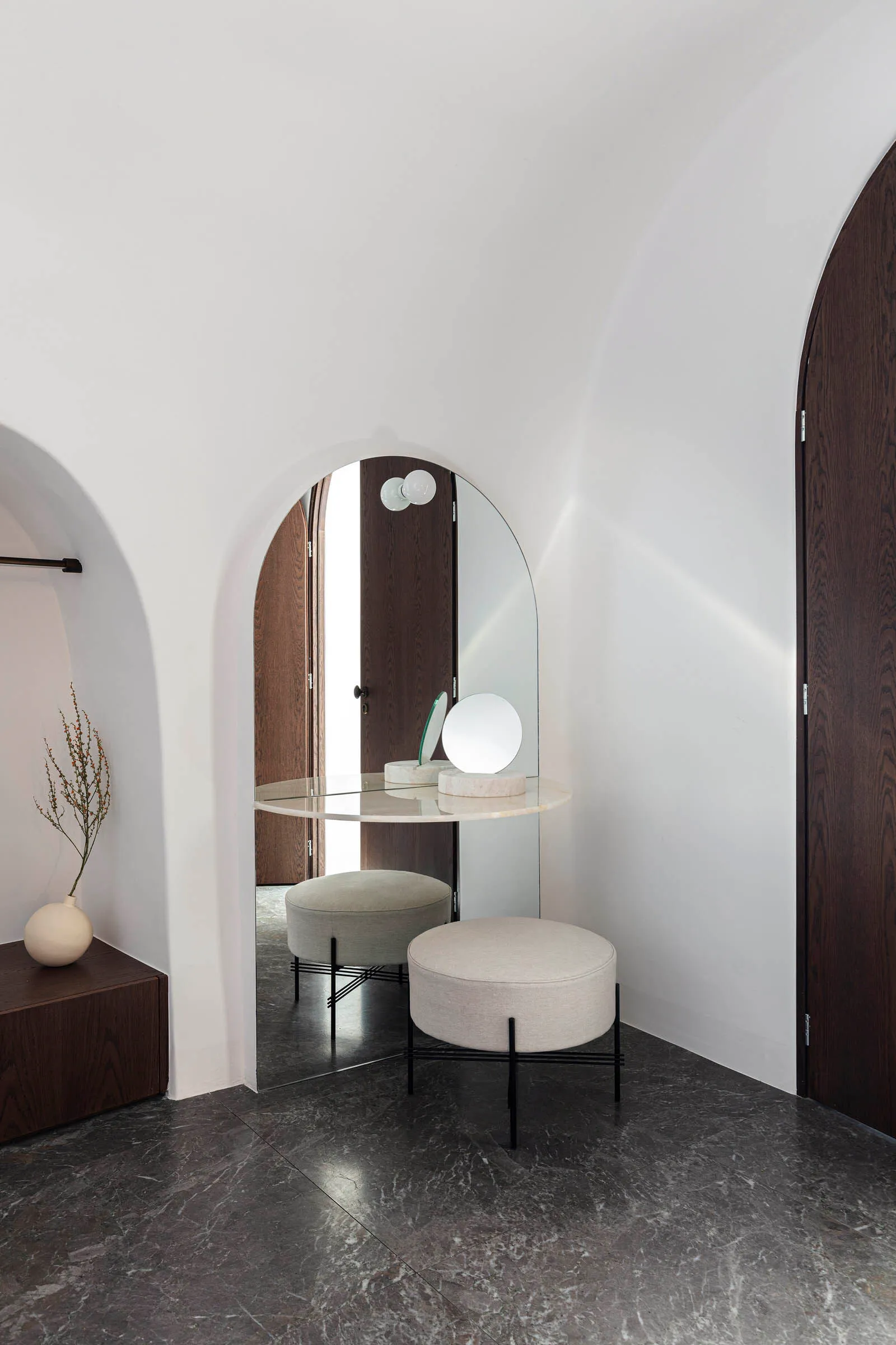 modern vanity room with a glass countertop and concrete countertop, featuring minimalist design