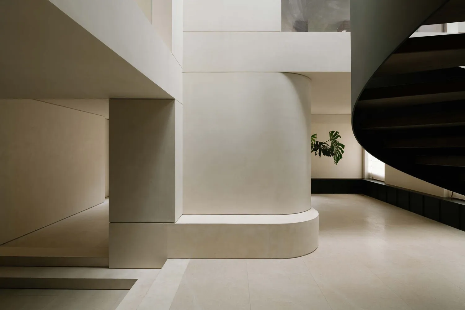 A modern interior space featuring concrete elements