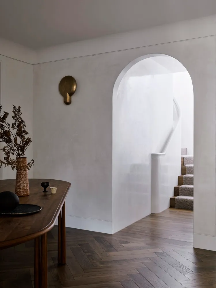 A minimalist interior design featuring wooden elements and stone accents.