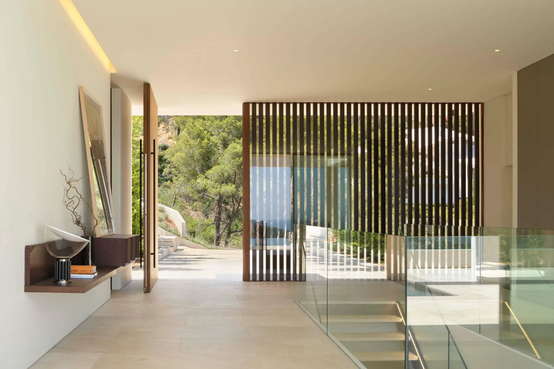 Contemporary interior design featuring glass window and minimalist decor.