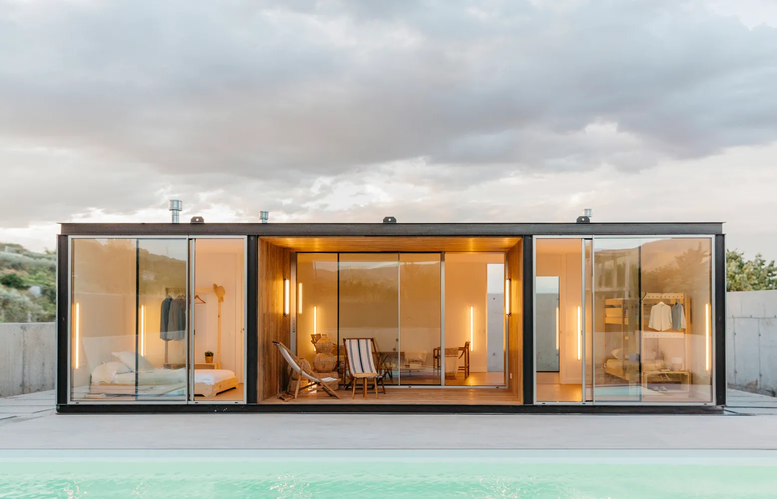 Modern minimalist residential house with a wood, glass, and concrete exterior.