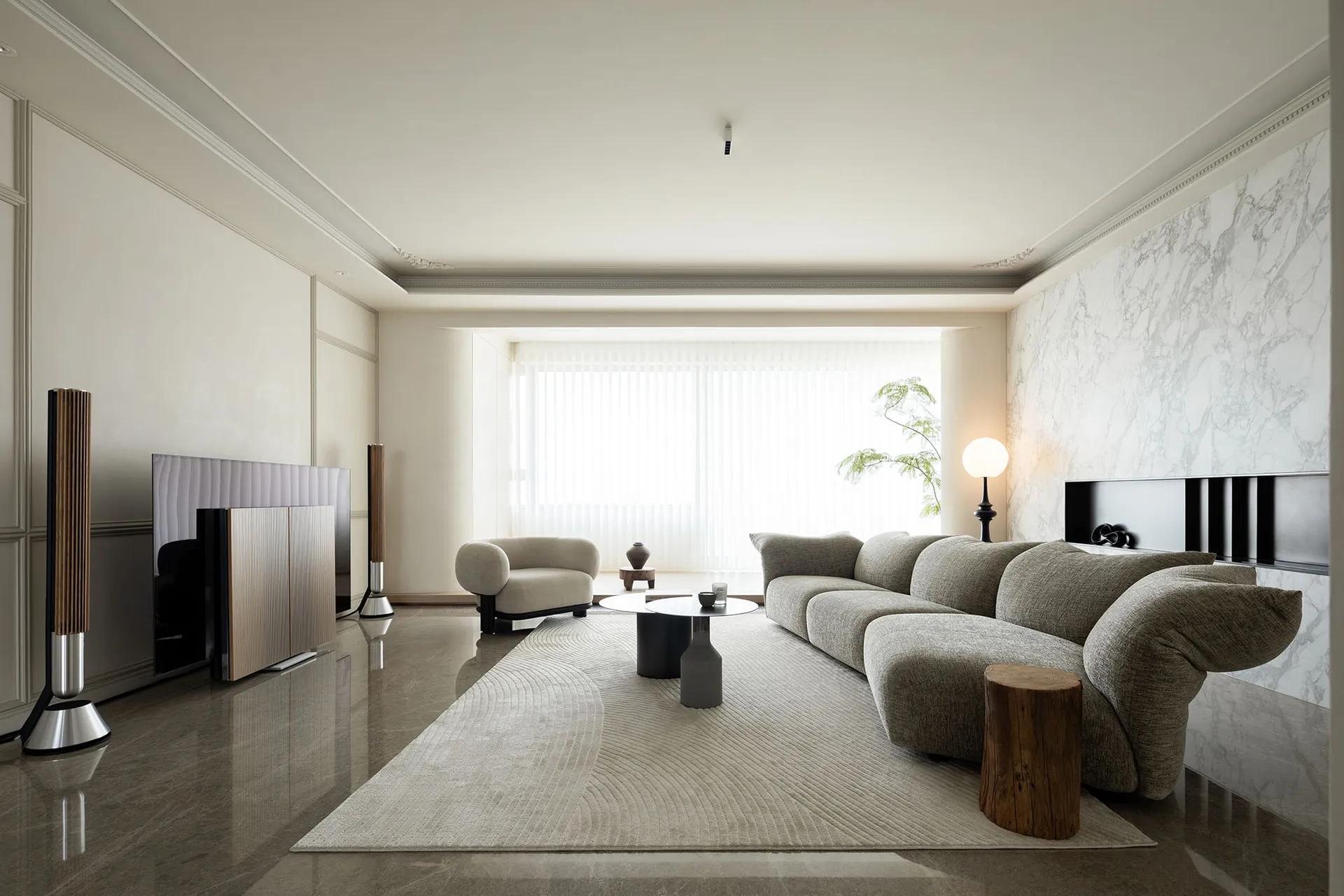 A modern living room featuring sandstone marble flooring and minimalist furniture design.