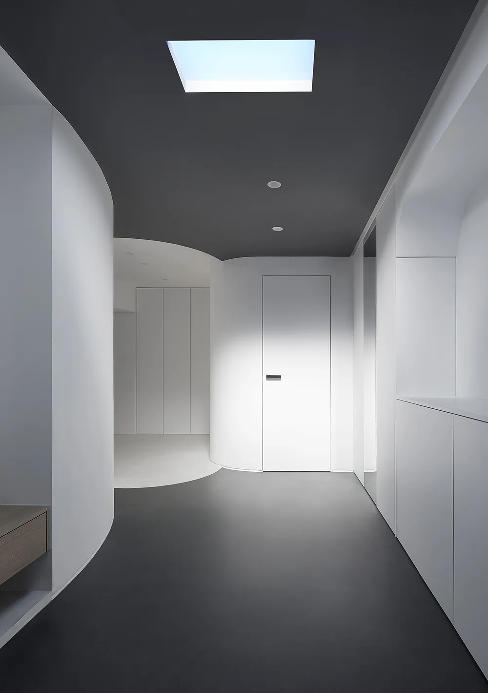 A minimalist space featuring white materials.