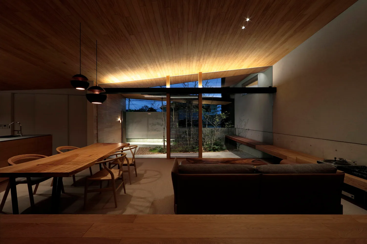 A modern living room with wooden furniture and a minimalist design.