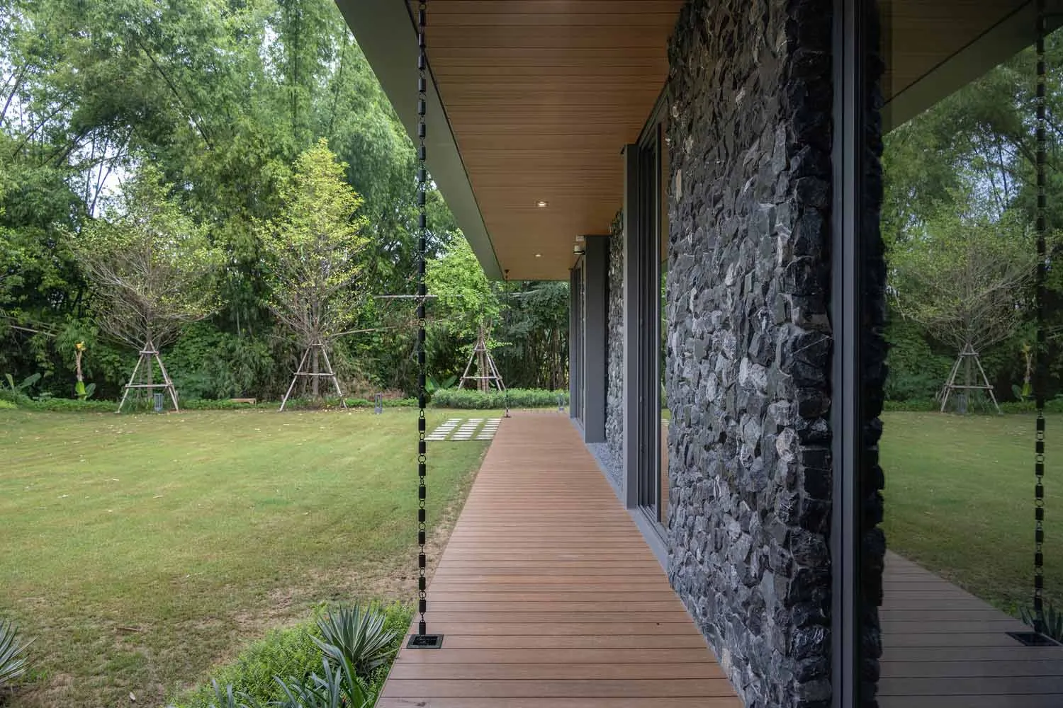A modern interior space featuring wood and stone materials