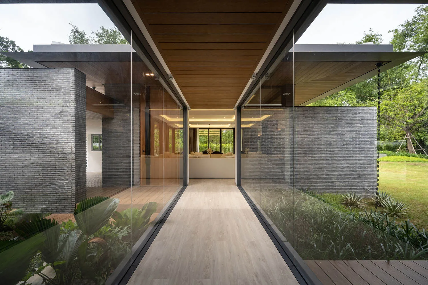 Modern exterior design featuring brick and glass materials, showcasing residential architecture.