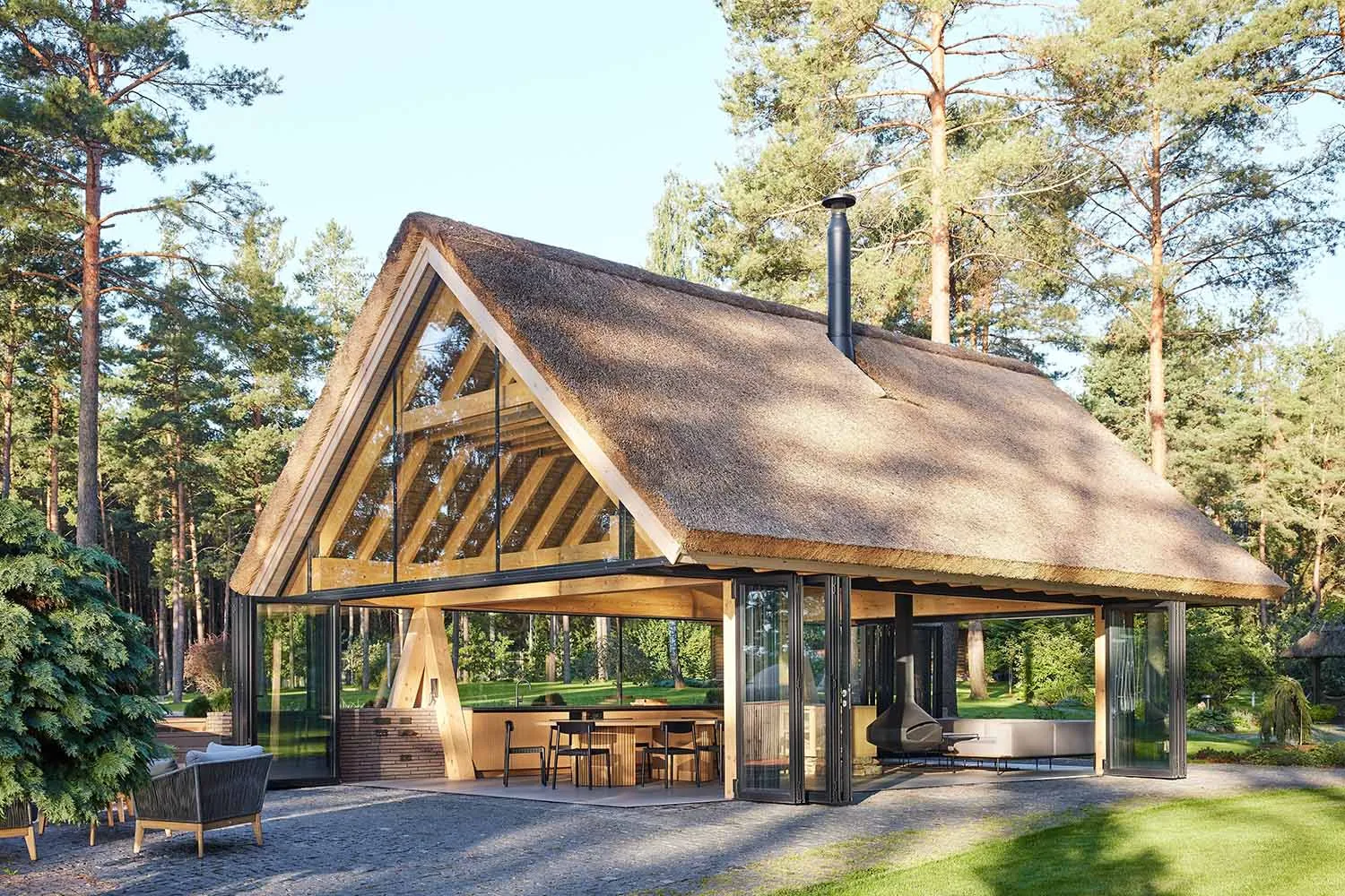 Modern residential building with a wooden roof and large glass windows.