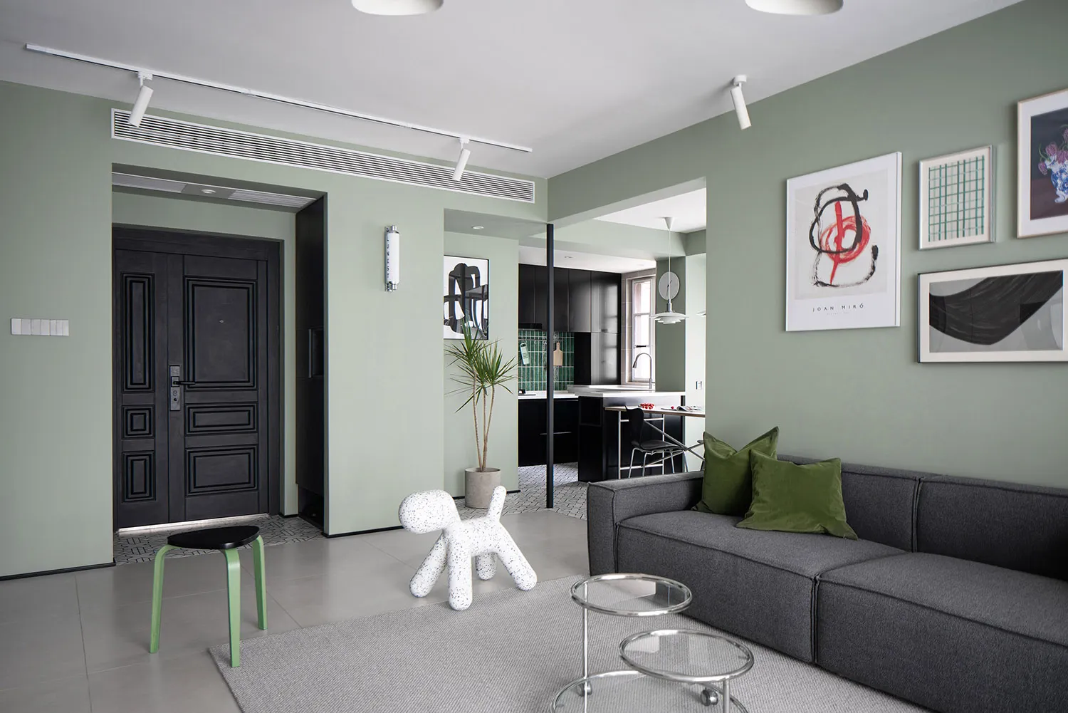 Modern residential interior with concrete, glass, and metal elements.