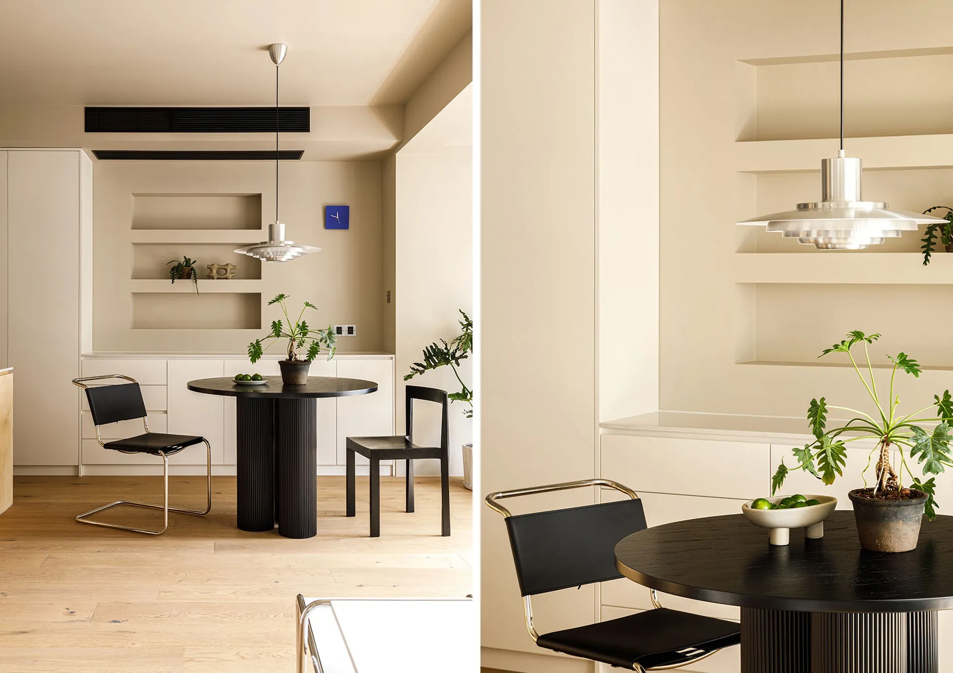 現代廚房早餐區,設有黑色圓桌、黑色餐椅與木地板。
