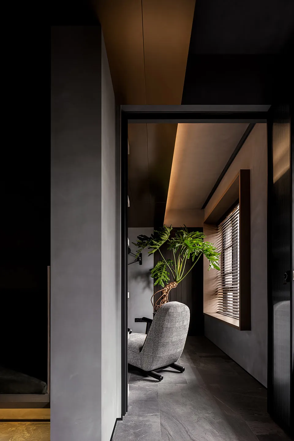 A modern minimalist residential interior featuring concrete and wood materials, showcasing clean lines and a serene atmospher