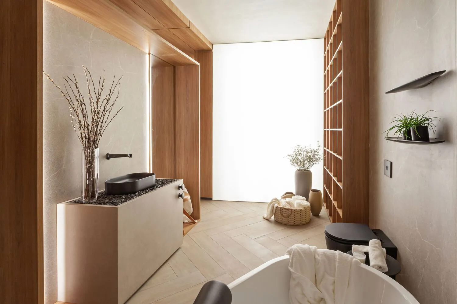 A modern minimalist bathroom featuring marble floor and walls, concrete walls, and wooden accents.