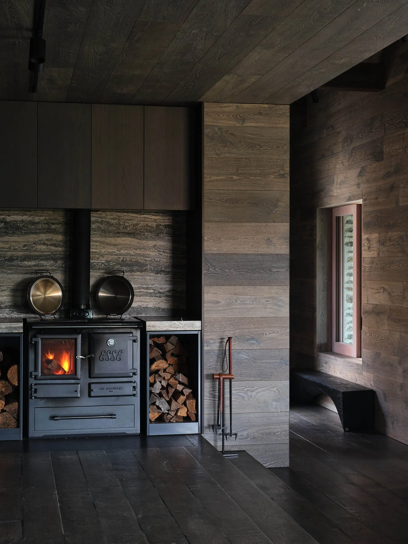 Industrially styled kitchen with metal stove and wood accents