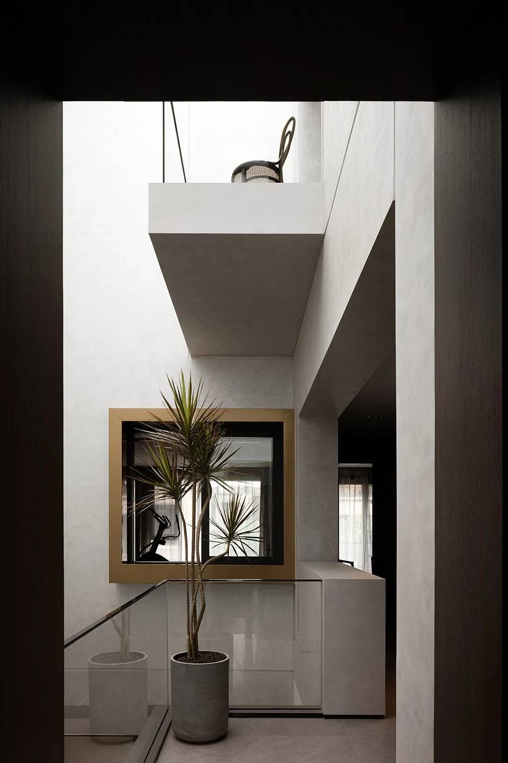 Modern living room with concrete walls and wooden furniture, featuring a minimalist design.