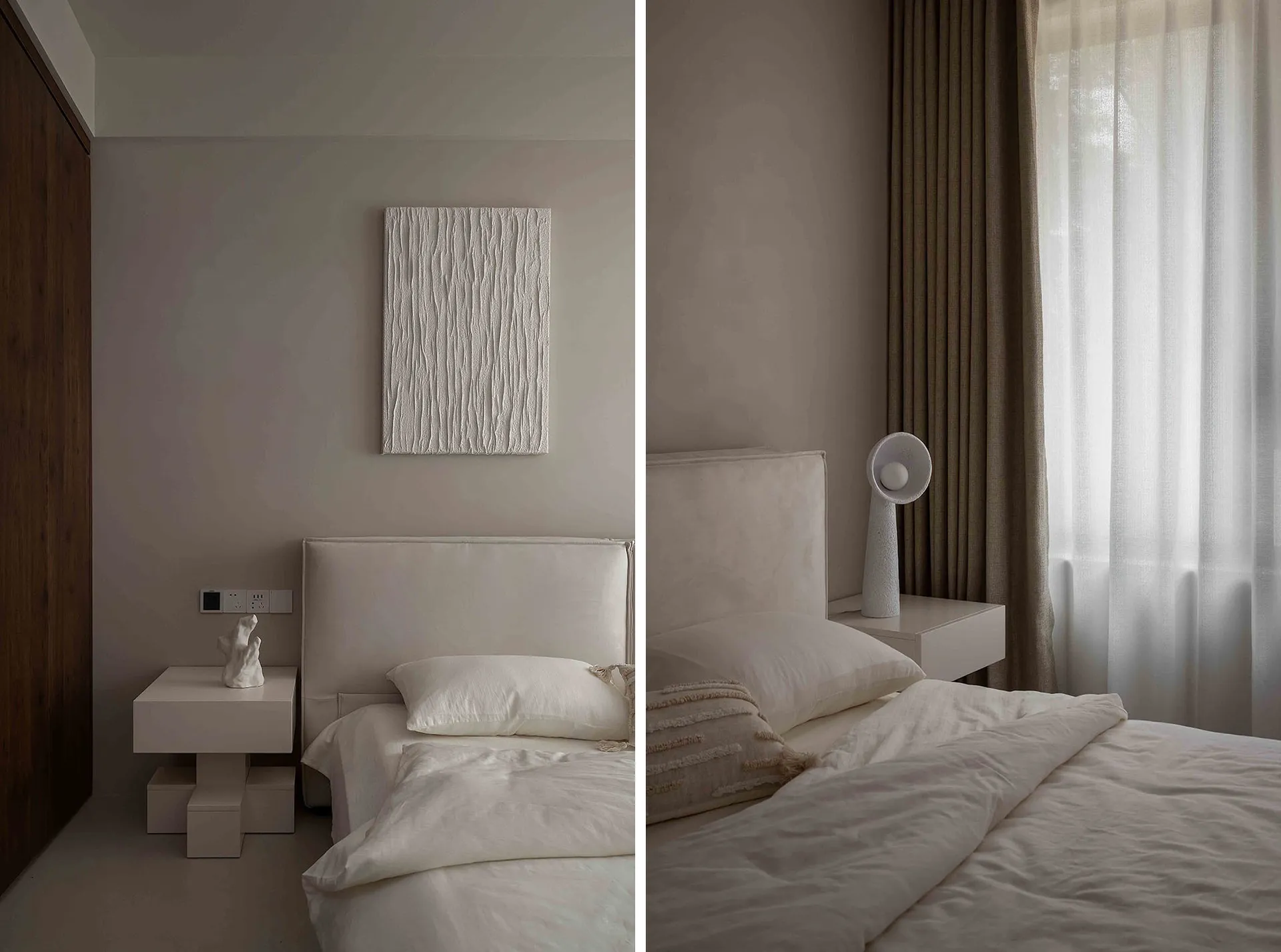 A minimalist bedroom with a white fabric bed, white bedding, and beige curtains. Simple nightstand and abstract artwork on th