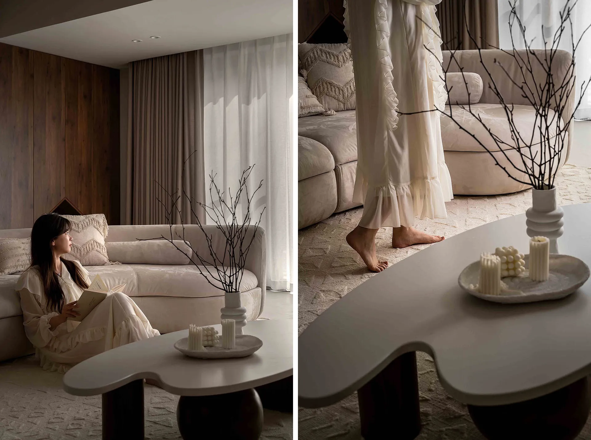 A modern lounge room with velvet cushions, white curtains, a bamboo branched plant, and a table.