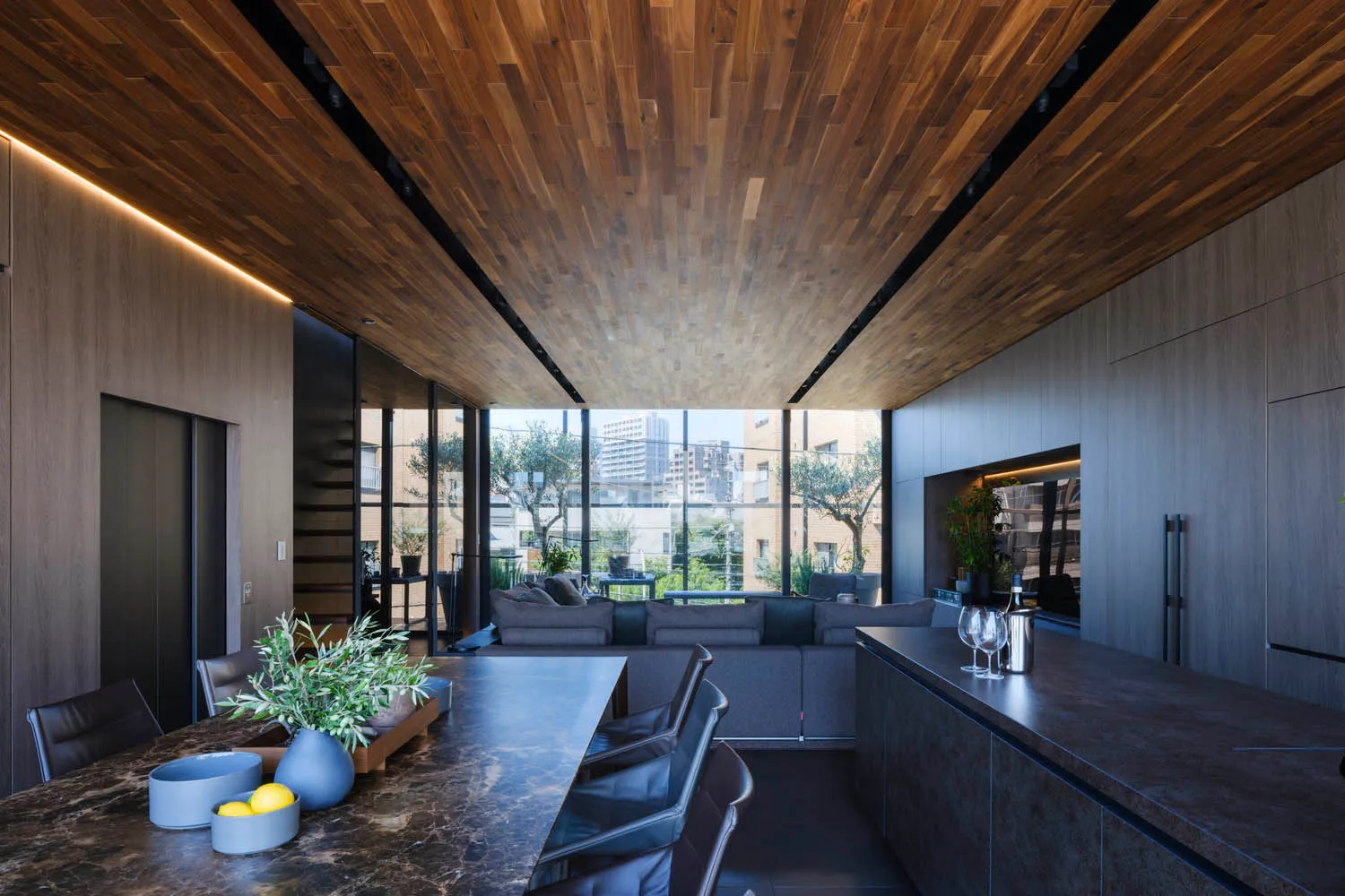 Modern residential kitchen featuring sleek, minimalist design with concrete and stone finishes.