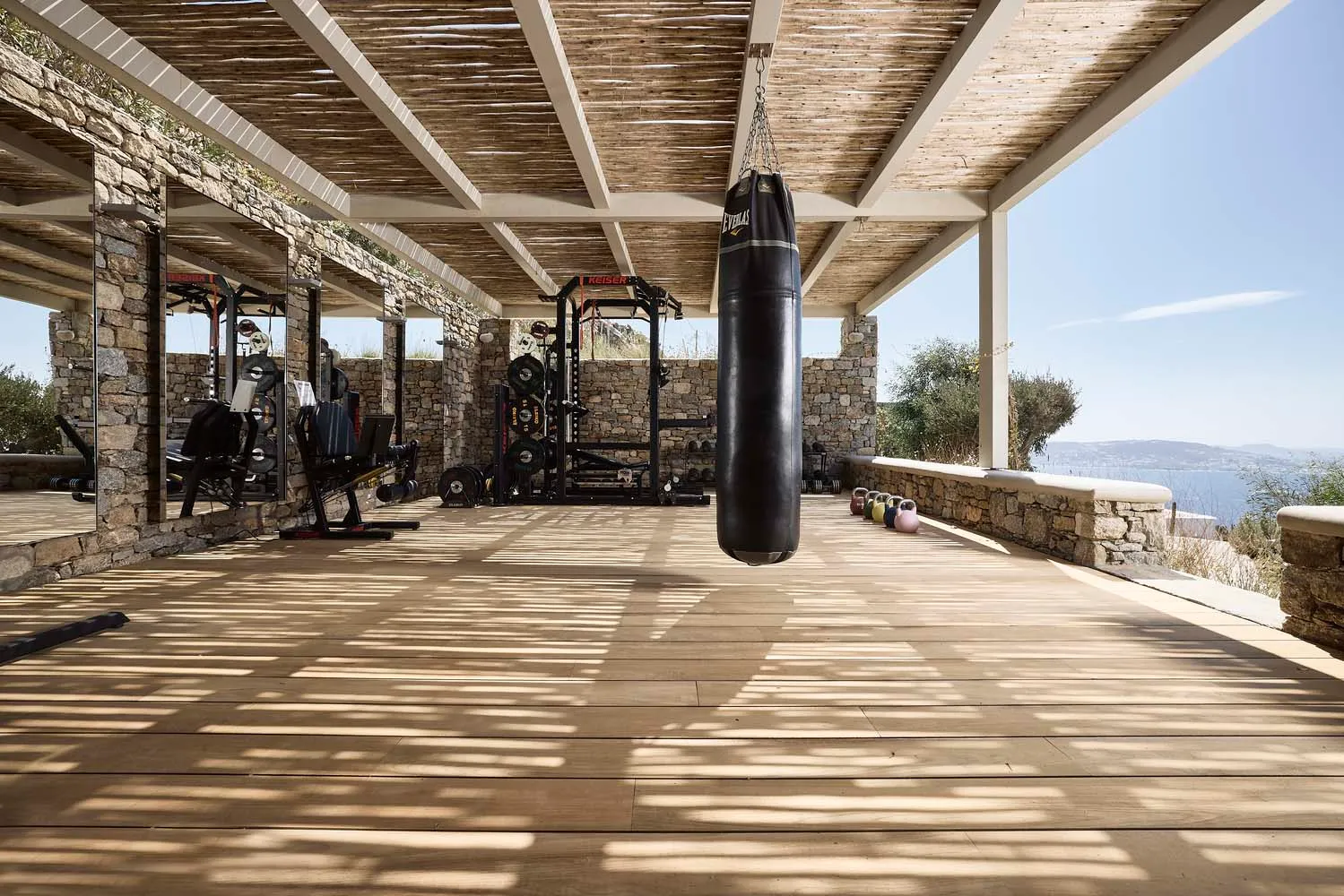 A minimalist fitness center with a floating platform.