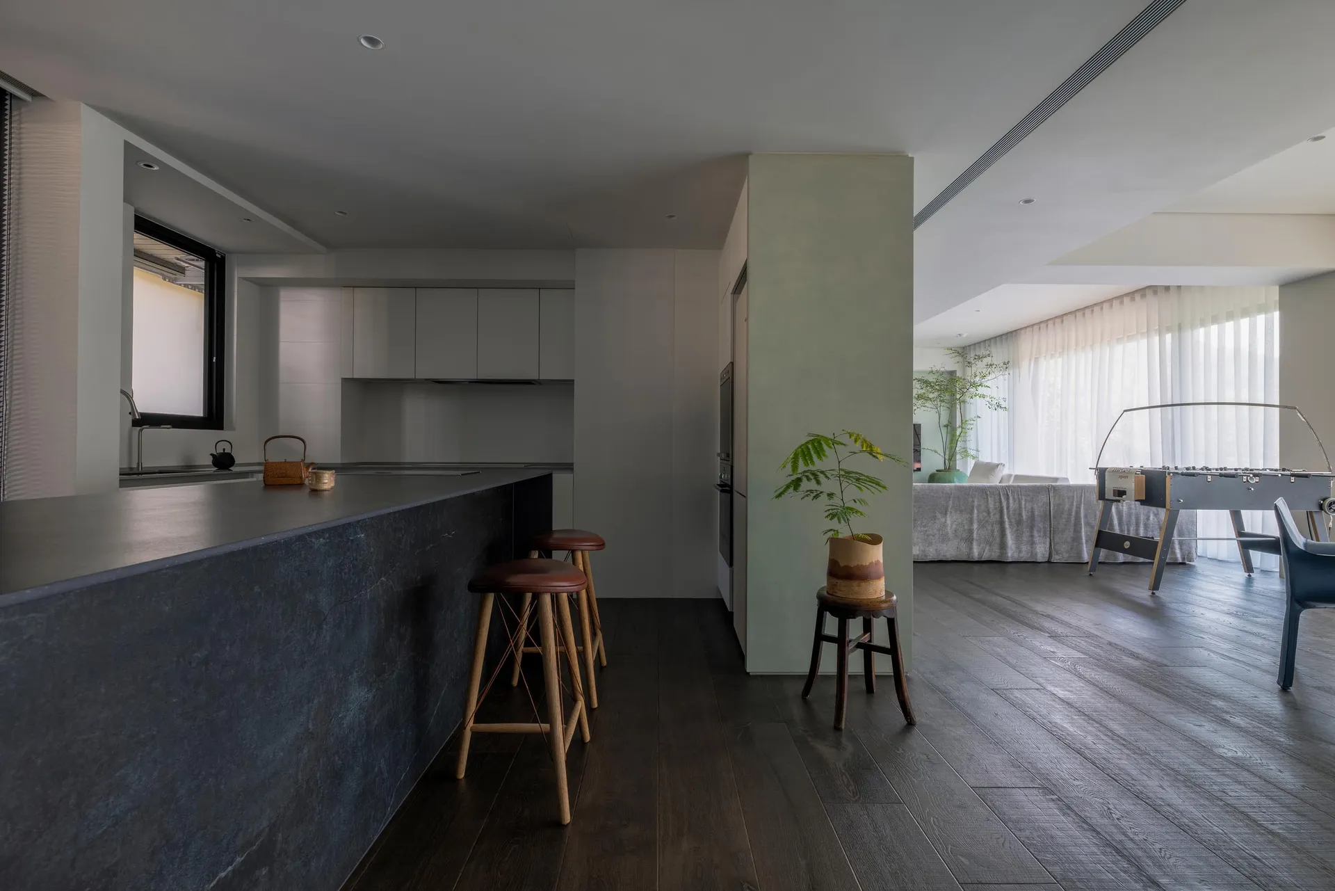 Modern living room featuring a concrete and wood design