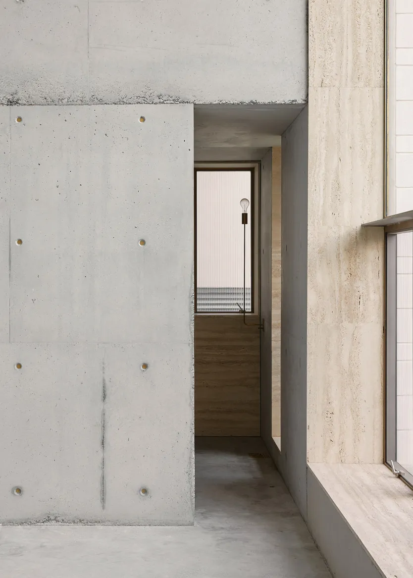 Modern interior with concrete walls and minimalist design elements.
