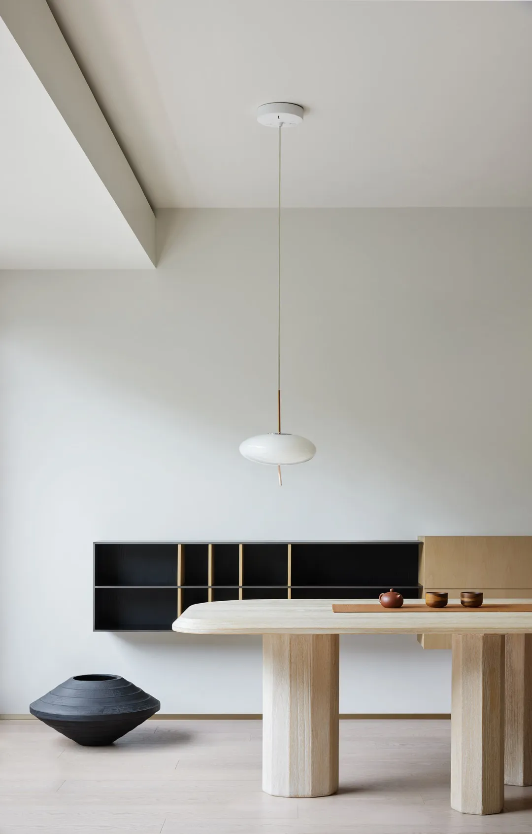A modern dining area featuring wood elements and minimalist design.