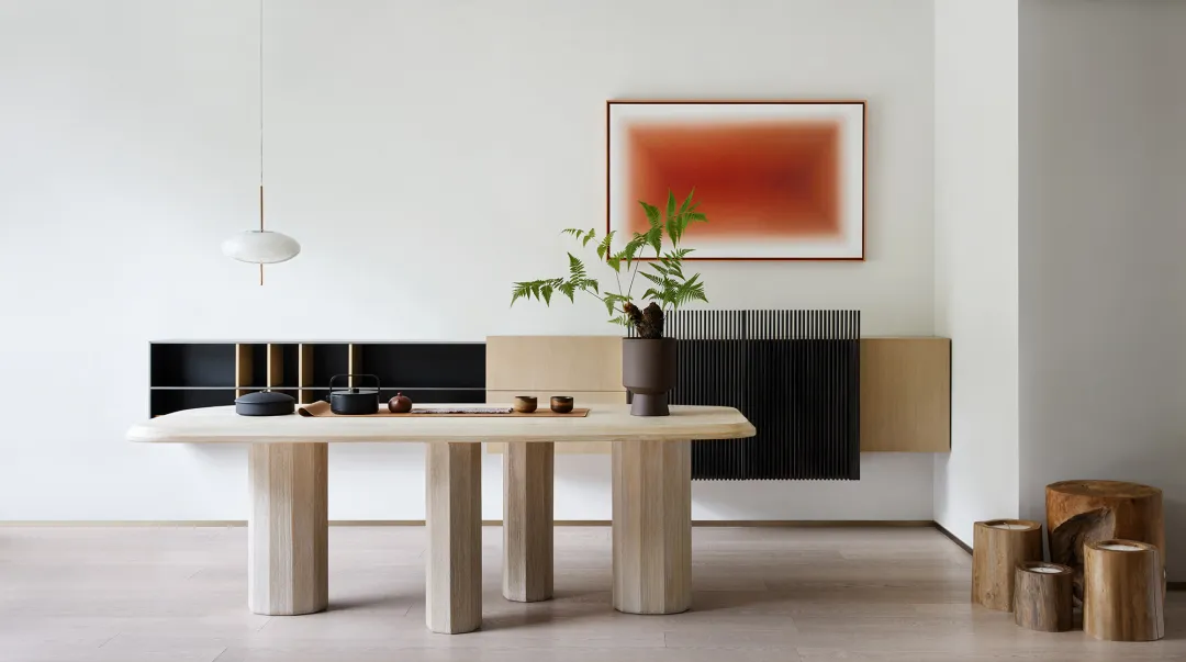 A modern interior design featuring a wooden living room with minimalist furniture, a large abstract painting, and a minimalis