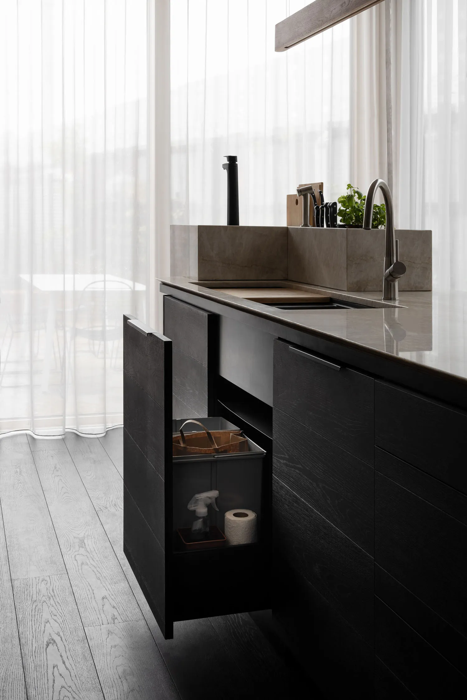 Modern kitchen featuring stainless steel appliances and marble countertops.