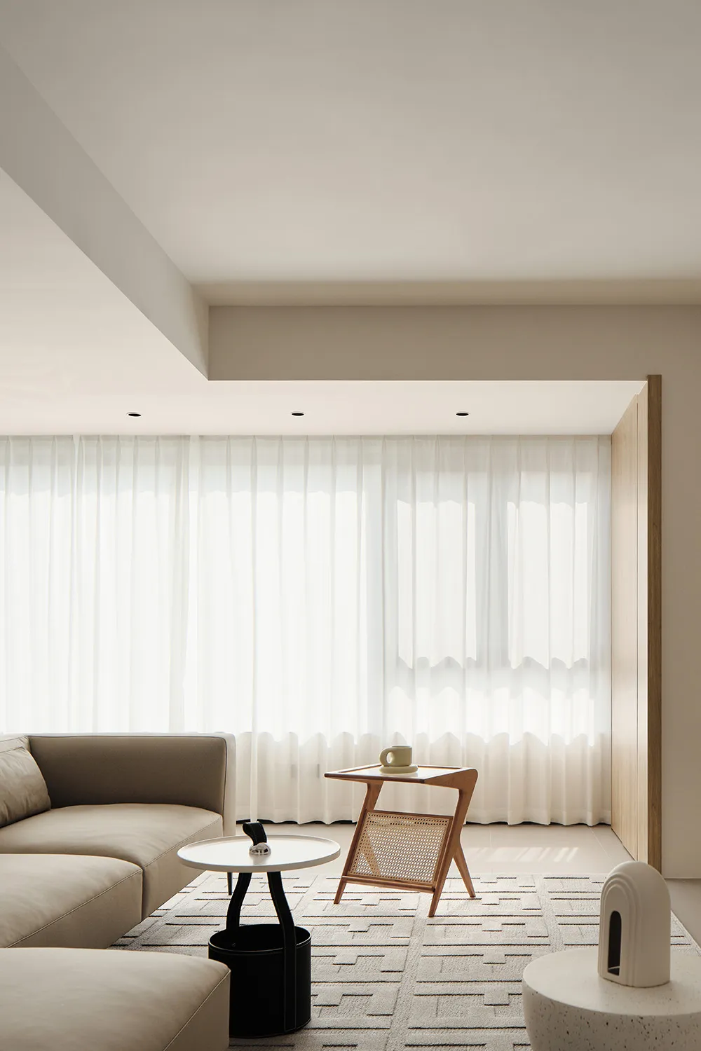 A modern living room featuring upholstered seating, wooden side tables, and glass windows with sheer curtains.