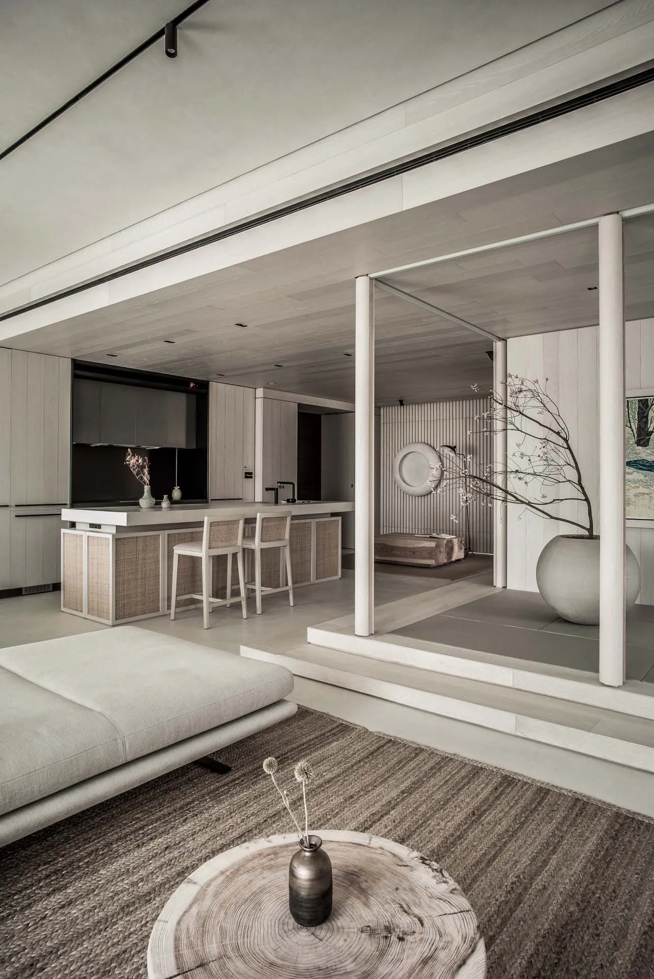 A modern interior living room with minimalist design and wooden materials, featuring a sofa, coffee table, and decorative vas