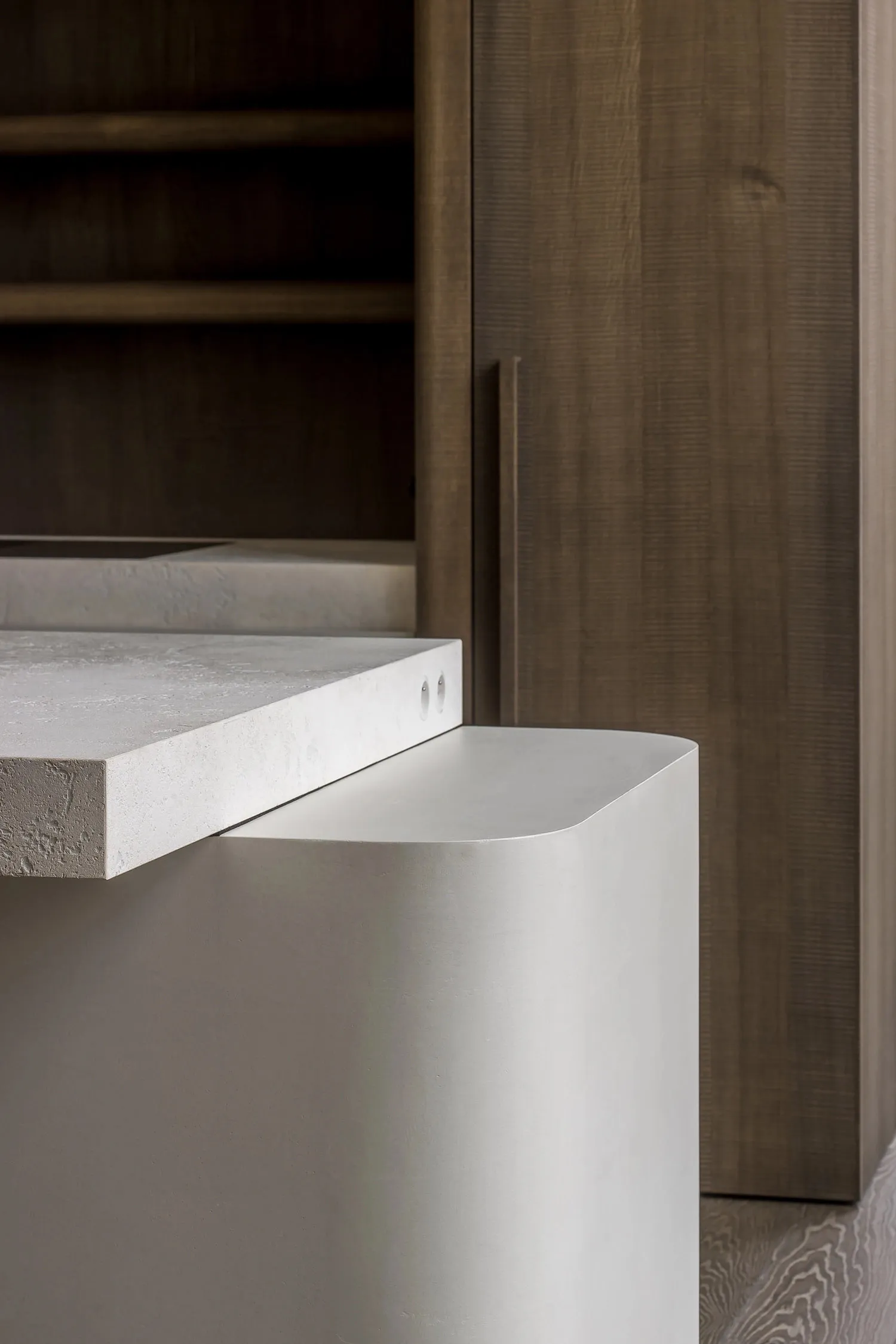 A modern interior space featuring sleek concrete details.
