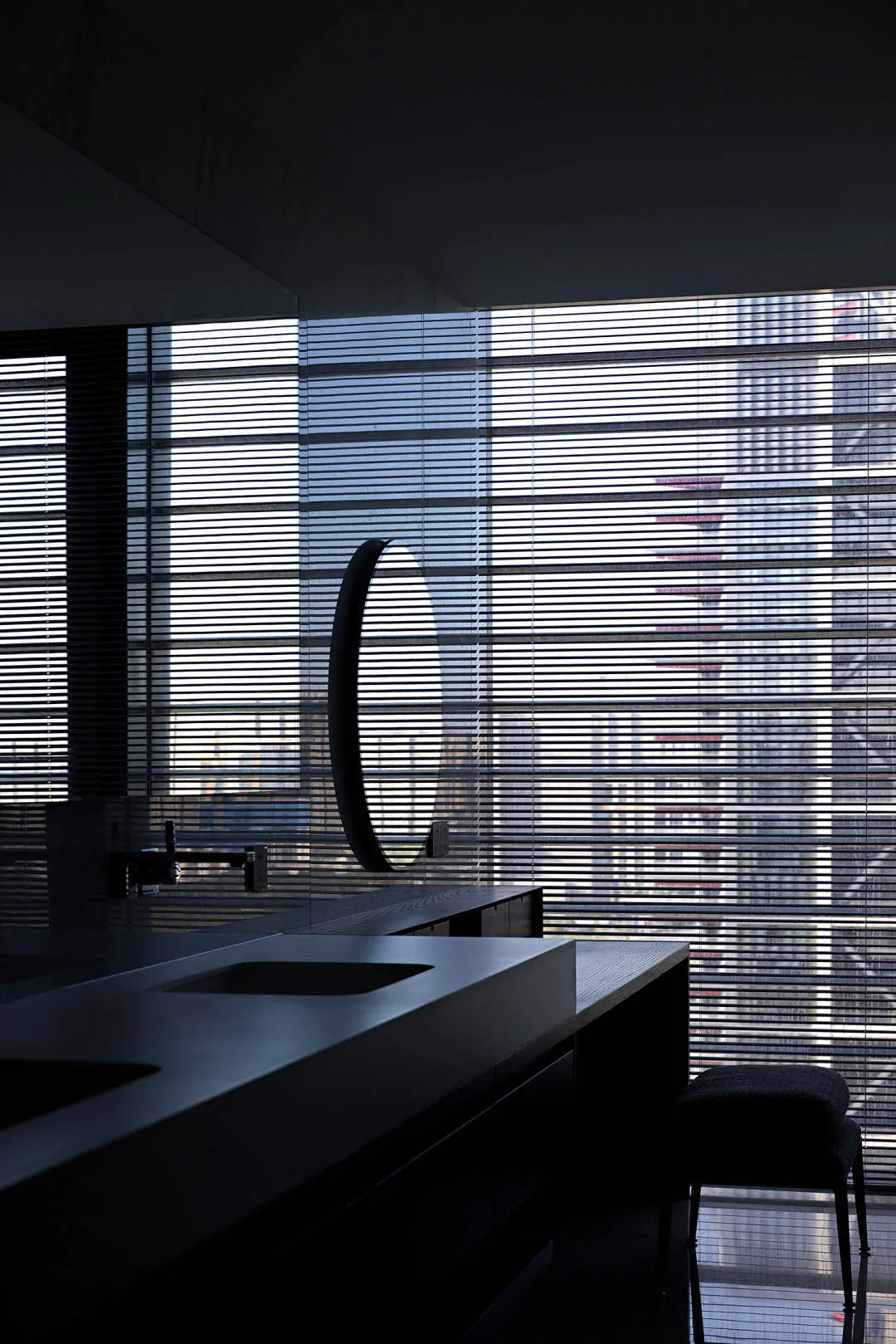 A modern interior with a glass window and minimalist design.