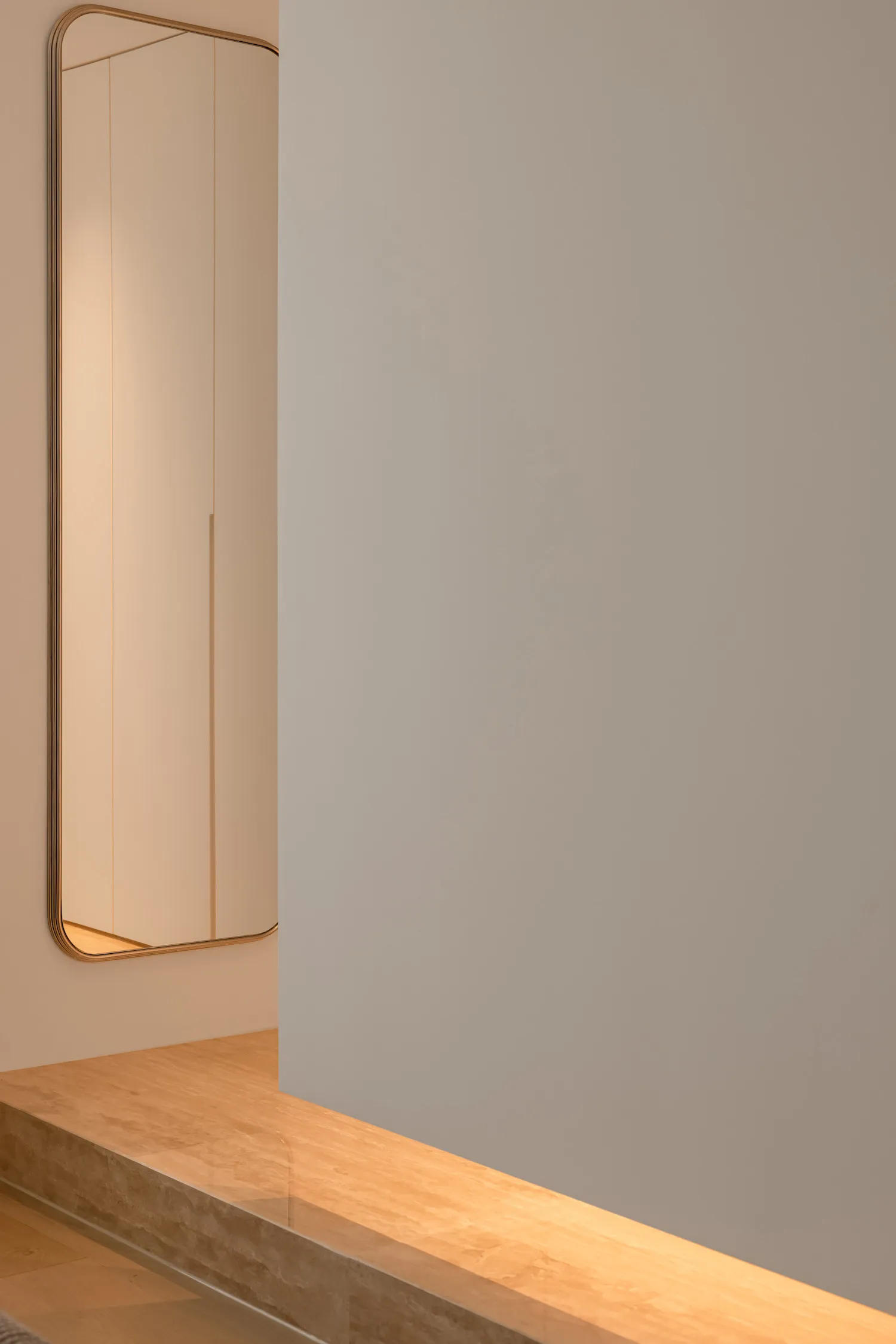 Modern minimalist interior space featuring glass materials and clean lines.