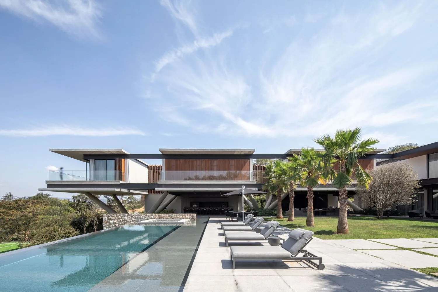 Modern residential house with concrete and glass exterior.
