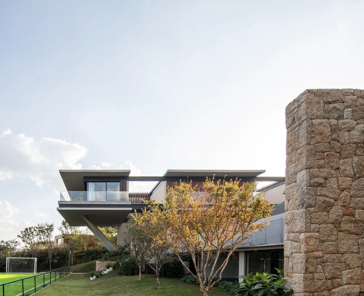 A modern residential home featuring a concrete exterior with a sleek, contemporary design.