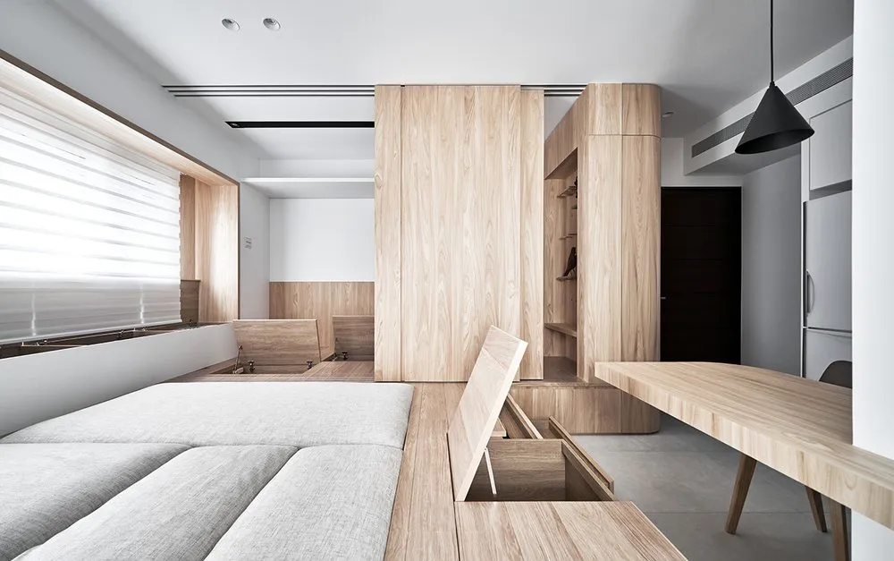 Modern living room featuring wooden furniture and flooring.