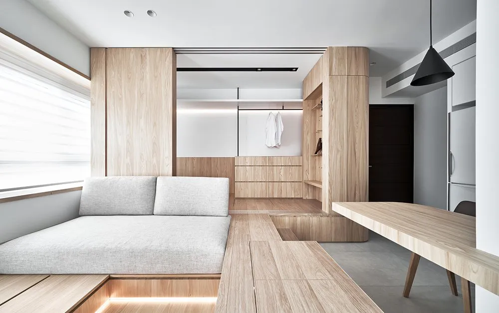 A modern living room with wooden furniture, minimalistic design, and clean lines.